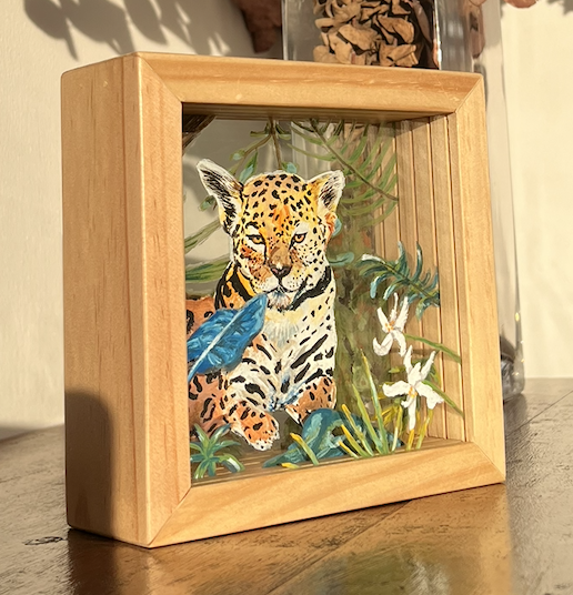 Micro Cosmos Posteluz — wooden panel with a jaguar illustration